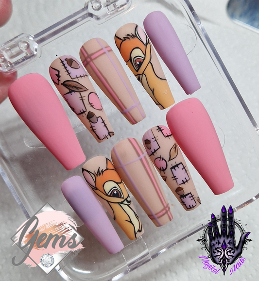 Pink and purple autumn nails featuring patchwork, tartan and a handpanted deer